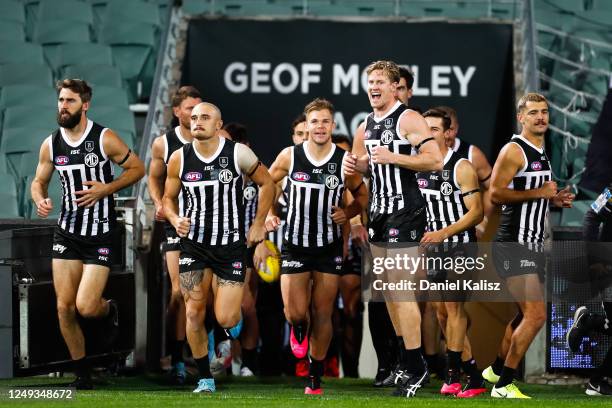 Tom Jonas of the Power leads his team onto the ground during the round 2 AFL match between the Port Adelaide Power and the Adelaide Crows at Adelaide...