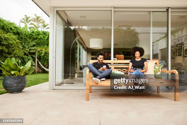 staying connected with outside world - contemporary couple stock pictures, royalty-free photos & images