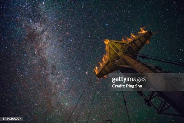 the milky way over ocean ships, and masts - sirius star stock pictures, royalty-free photos & images