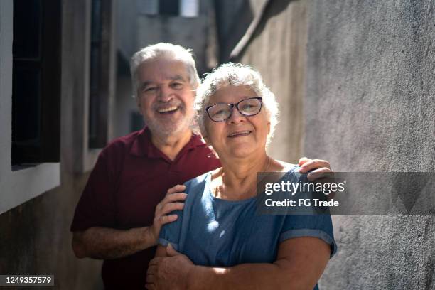 portrait of senior couple or siblings at home - old brother stock pictures, royalty-free photos & images