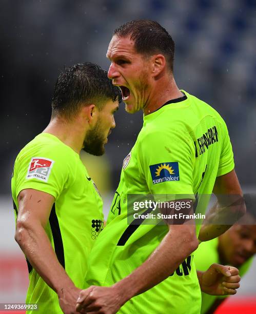 Benedikt Rocker of SV Wehen Wiesbaden celebrates at the final whistle of the Second Bundesliga match between Holstein Kiel and SV Wehen Wiesbaden at...