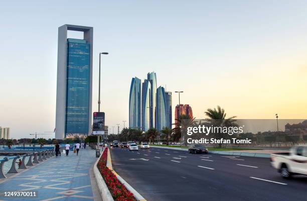 etihad towers and downtown abu dhabi view from the al marina island bridge in the united arab emirates capital city - abu dhabi bridge stock pictures, royalty-free photos & images