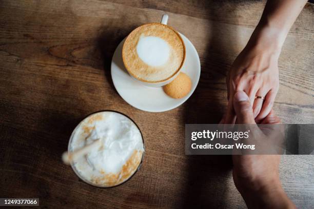 concept of couple in love having coffee at the cafe - café vu de haut photos et images de collection