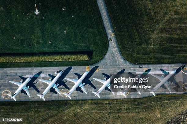 aerial view of parked airplanes at dübendorf airport - a320-aircraft-top-view stock pictures, royalty-free photos & images