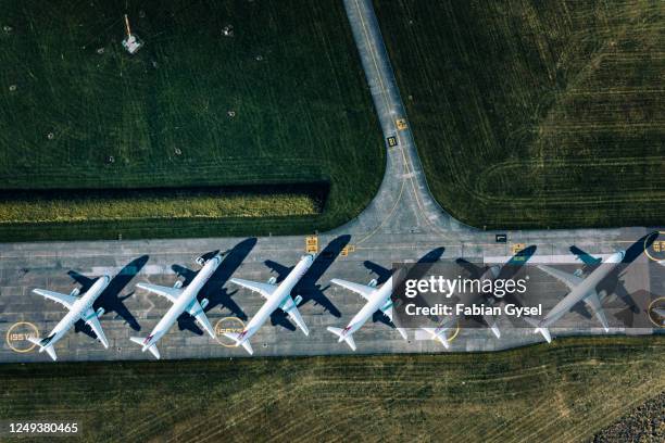 aerial view of parked airplanes at dübendorf airport - aircraft tarmac stock pictures, royalty-free photos & images