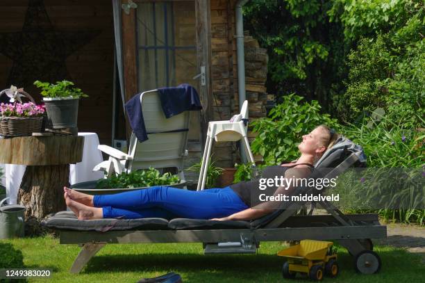 woman on lounge chair - northern europe stock pictures, royalty-free photos & images