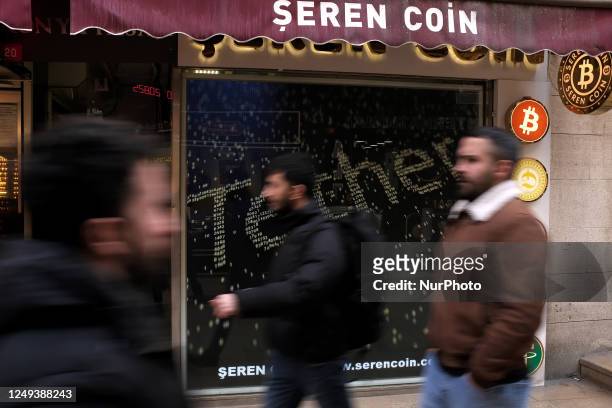 People passing by the Bitcoin office in Istanbul, Turkey on March 24, 2023. Bitcoin, which has reached its highest level in recent months, rose to...