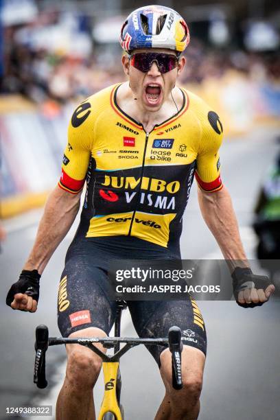 Belgian Wout van Aert of Team Jumbo-Visma celebrates as he crosses the finish line of the one day cycling race 'E3 Saxo Bank Classic' on March 24,...