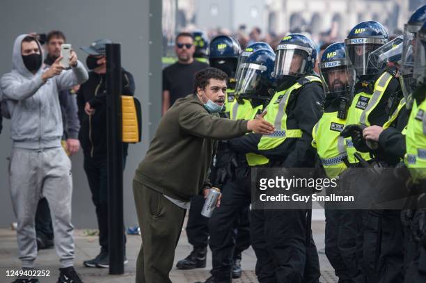 Far right DFLA supporter argues with riot Police on June 13, 2020 in London, England. A number of anti-racism protesters have gathered for...