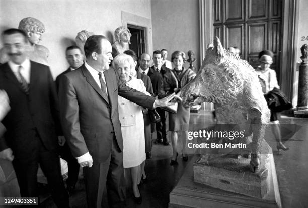 American politicians Muriel Humphrey Brown and Hubert Humphrey , who is touching Roman Art sculpture "Cinghiale" , at the Uffizi Gallery, Florence...