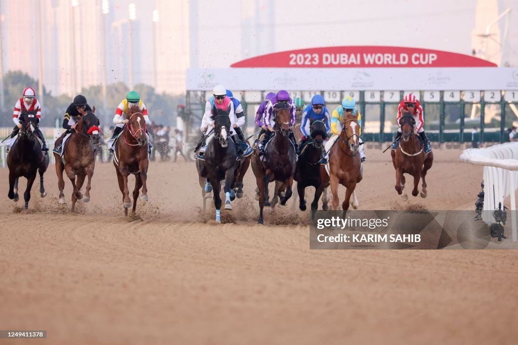 Dubai Raceway Jockeys compete in the UAE Derby at the Dubai World Cup horse racing ...
