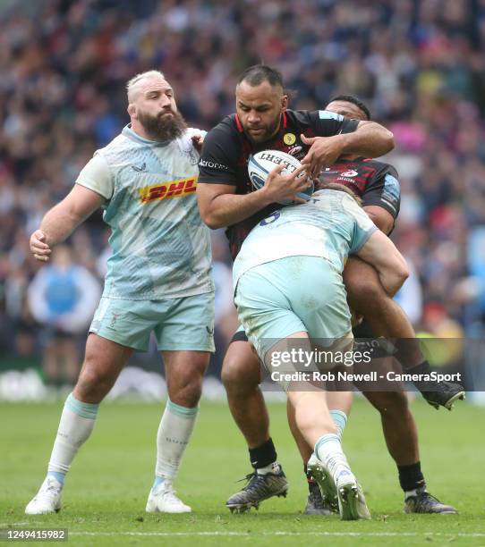 Saracens' Billy Vunipola is held up by Harlequins' Alex Dombrandt with Harlequins' Joe Marler also in close attendance during the Gallagher...