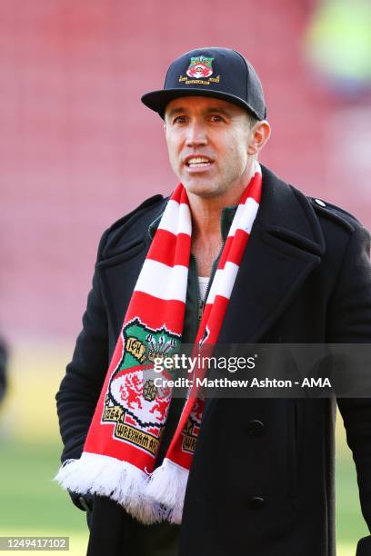 Wrexham co-owner Rob McElhenney wearing a scarf and hat of Wrexham during the Vanarama National League match between Wrexham and York City at the...