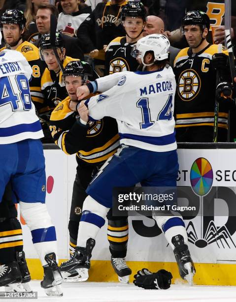 Garnet Hathaway of the Boston Bruins and Pat Maroon of the Tampa Bay Lightning fight during the first period at the TD Garden on March 25, 2023 in...