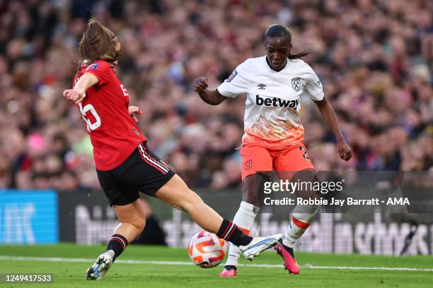 Maya Le Tissier of Manchester United Women tackles Viviane Asseyi of West Ham United Women during the FA Women's Super League match between...