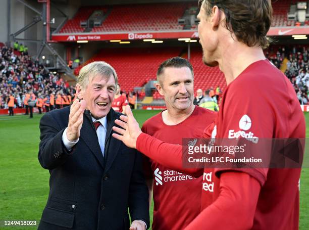 Kenny Dalglish, Robbie Keane and Sami Hyppia of Liverpool Legends after the game at Anfield on March 25, 2023 in Liverpool, England.