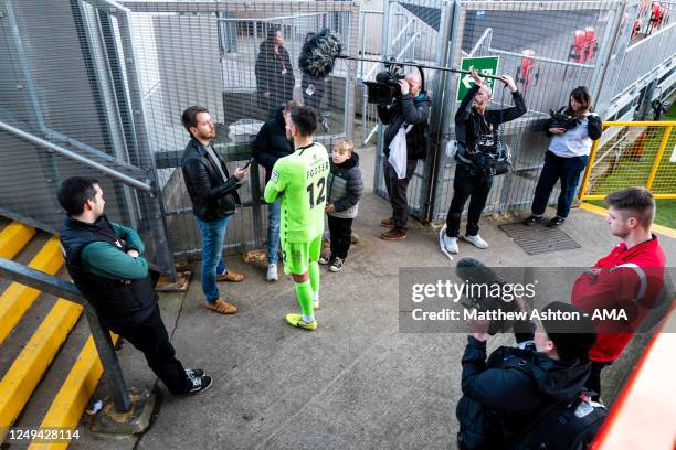 Goalkeeper Ben Foster of Wrexham gets interviewed after the match whilst the Disney Channel TV film for the documentary This Is Wrexham during the...