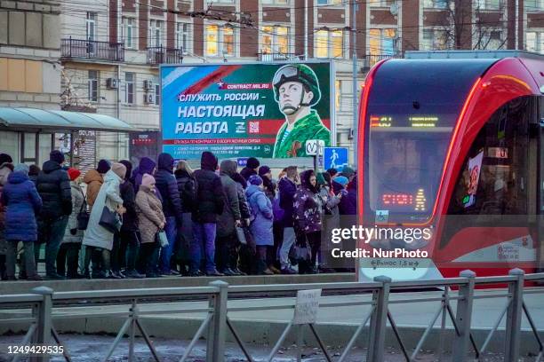 Banner with a soldier image in the streets of Saint Petersburg promoting the army recruitment. Banner says ''serve russia, with a real work''