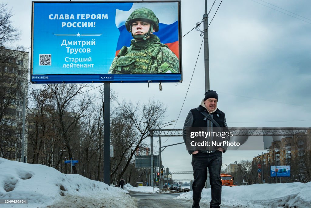 Russian Support A man walks under a huge banner in support of the russian invasion of ...