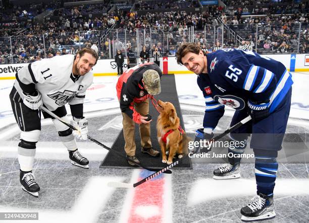 Anze Kopitar of the Los Angeles Kings and Quinton Byfield of the Los Angeles Kings pose for a photo during the ceremonial puck drop prior to the game...