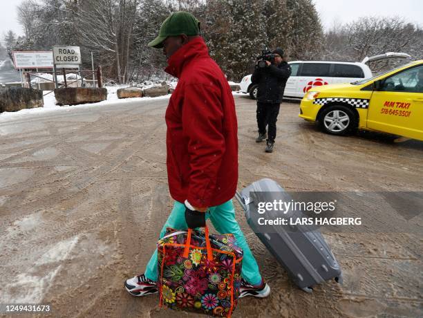 Refugee arrives at the Roxham Road border crossing to at the US-Canada border in Champlain, New York, on March 25, 2023. - The Roxham Road crossing...