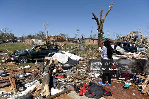 Kenterica Sardin looks on from her damaged home after a series of powerful storms and at least one tornado on March 25, 2023 in Rolling Fork,...