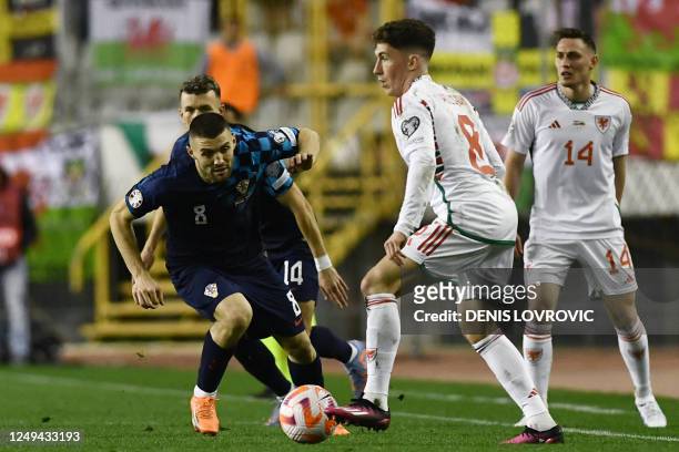 Croatia's midfielder Mateo Kovacic and Wales' midfielder Harry Wilson fight for the ball during the UEFA Euro 2024 qualification football match...