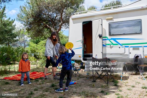 Family enjoys a weekend with their motorhome at the Monte Holiday campsite on June 13, 2020 in Gargantilla de Lozoya y Pinilla de Buitrago, Spain....