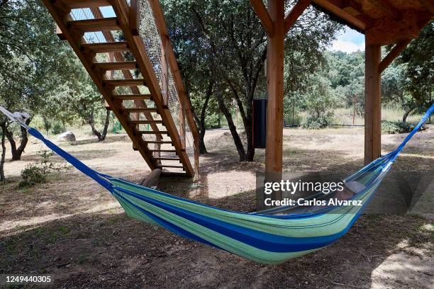 Man rests in a hammock at the Monte Holiday campsite on June 13, 2020 in Gargantilla de Lozoya y Pinilla de Buitrago, Spain. The campsite, which had...