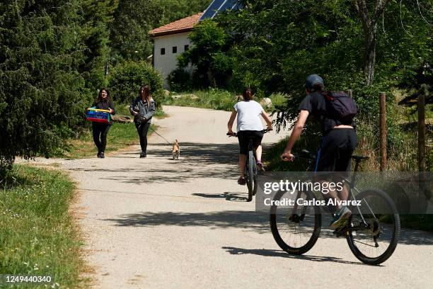 Some people walk and bike through the Monte Holiday campsite on June 13, 2020 in Gargantilla de Lozoya y Pinilla de Buitrago, Spain. The campsite,...