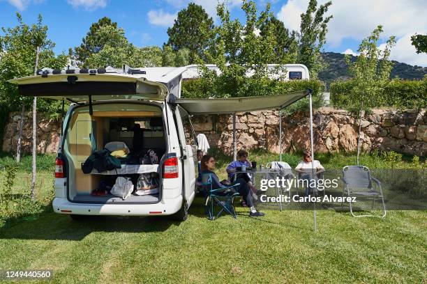 Group of friends enjoys a weekend with their motorhome at the Monte Holiday campsite on June 13, 2020 in Gargantilla de Lozoya y Pinilla de Buitrago,...