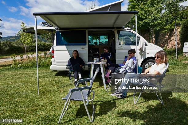 Group of friends enjoys a weekend with their motorhome at the Monte Holiday campsite on June 13, 2020 in Gargantilla de Lozoya y Pinilla de Buitrago,...