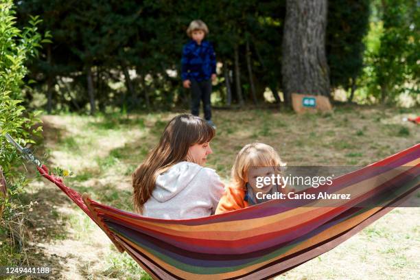 Family enjoys a weekend with their motorhome at the Monte Holiday campsite on June 13, 2020 in Gargantilla de Lozoya y Pinilla de Buitrago, Spain....