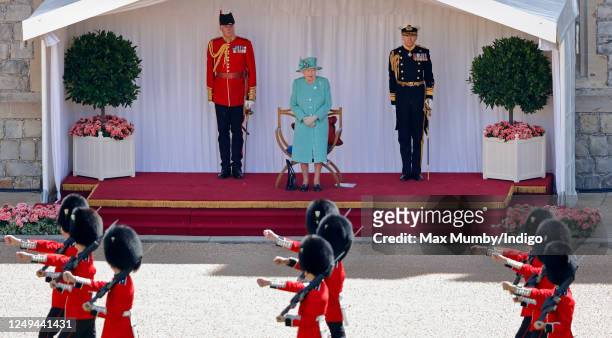 Queen Elizabeth II attends a military ceremony in the Quadrangle of Windsor Castle to mark her Official Birthday on June 13, 2020 in Windsor,...