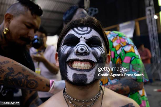 Person smiles during the 7th International Tattoo Convention Mitad del Mundo at Centro de Exposiciones on March 25, 2023 in Quito, Ecuador.