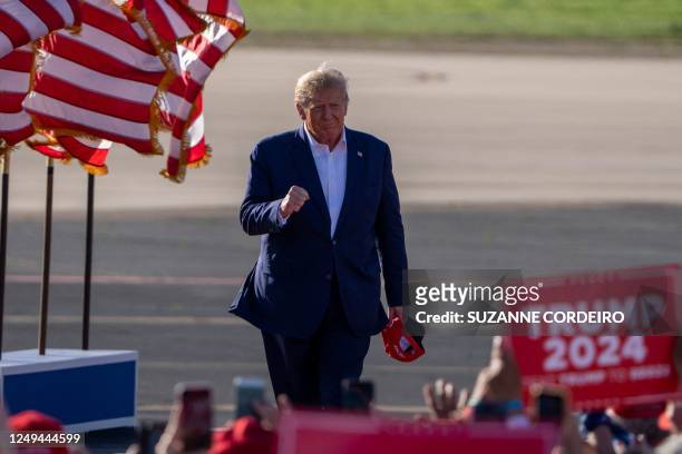 Former US President Donald Trump gestures as he arrives to speak during a 2024 election campaign rally in Waco, Texas, March 25, 2023. - Trump held...
