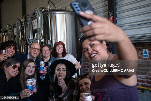Beer producers pose for a selfie picture with the US General Consul in Tijuana, Tom Reott , during the launching of a new tap craft beer of the "Dos...