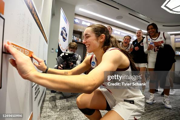 Georgia Amoore of the Virginia Tech Hokies move the sticker on the ...