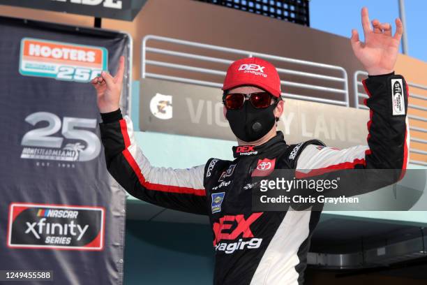 Harrison Burton, driver of the DEX Imaging Toyota, celebrates in Victory Lane after winning the NASCAR Xfinity Series Hooters 250 at Homestead-Miami...