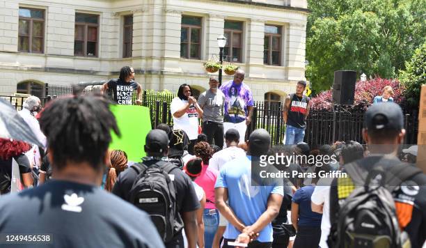 Jacquelyn Johnson, Marcus Coleman and Kenneth Johnson speak onstage during the Justice For Kendrick Johnson Rally at the Georgia State Capitol on...