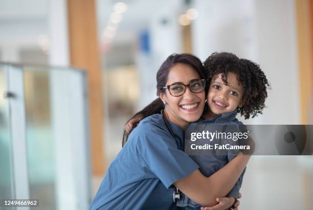 middle eastern nurse with patient - nurses laughing stock pictures, royalty-free photos & images