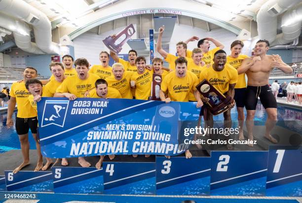 The California Bears celebrate on the podium after winning the Team National Championship during the Division I Mens Swimming and Diving...