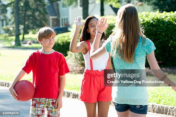 neighborhood kids playing outdoors - kickball stock pictures, royalty-free photos & images