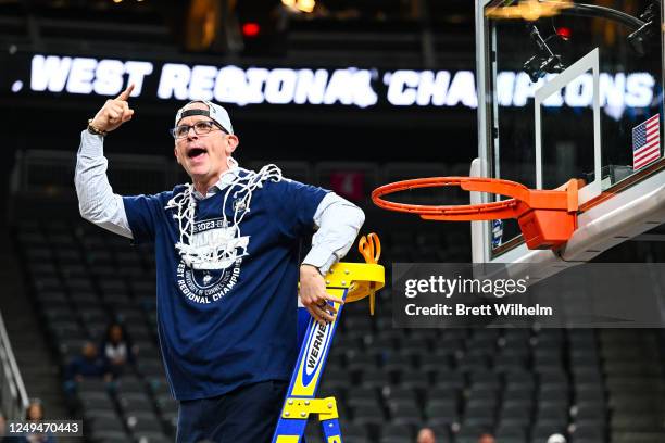 Head coach Dan Hurley of the Connecticut Huskies celebrates their win against the Gonzaga Bulldogs by cutting down the net during the Elite Eight...