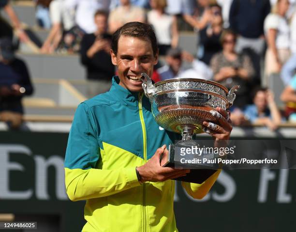 Rafael Nadal of Spain celebrates with the trophy after defeating Casper Ruud of Norway during the men's singles final on day fifteen of the French...
