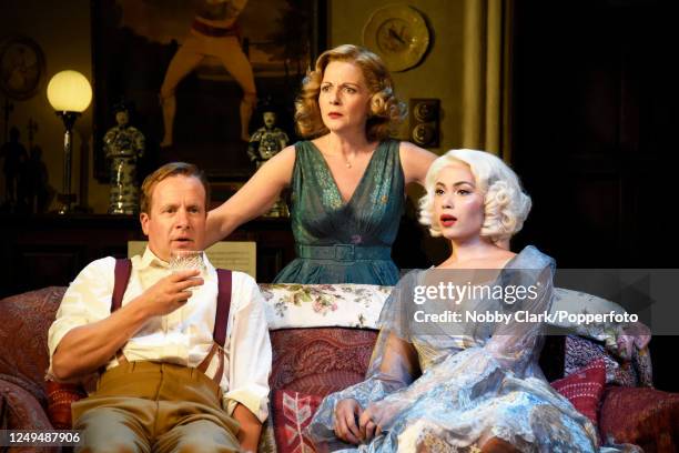 British actors Geoffrey Streatfeild, Lisa Dillon and Madeleine Mantock performing as Charles Condomine, Ruth Condomine and Elvira respectively in a...