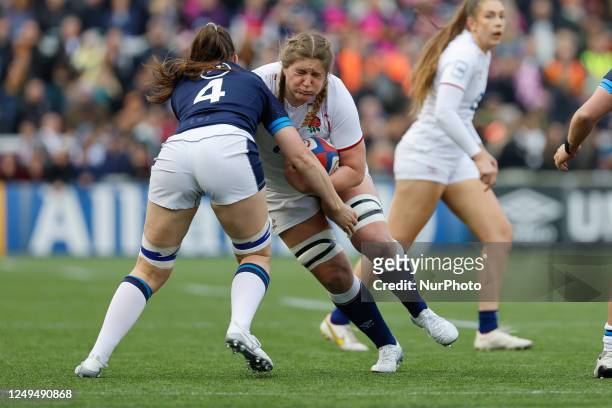 Poppy Cleall of England runs in to Lyndsay O'Donnell of Scotland during the Tik Tok Women's Six Nations match between England Women and Scotland...