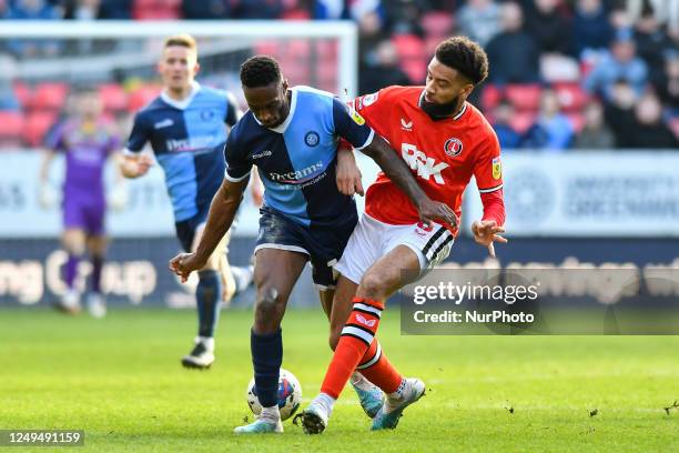 Brandon Hanlan of Wycombe battles for possession with Michael Hector of Charlton during the Sky Bet League 1 match between Charlton Athletic and...