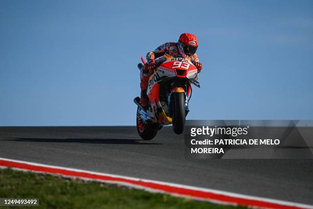 Honda Spanish rider Marc Marquez rides during the warm-up before the MotoGP race of the Portuguese Grand Prix at the Algarve International Circuit in...