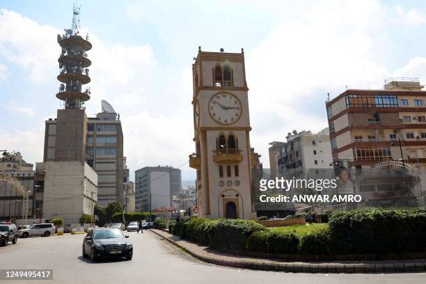 Clock tower in Beirut's Jdeideh district indicates the time on March 26 after Lebanon's government announced a decision to delay daylight savings. -...